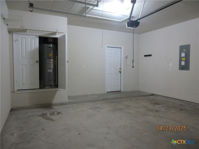garage with a garage door opener, electric panel, and electric water heater