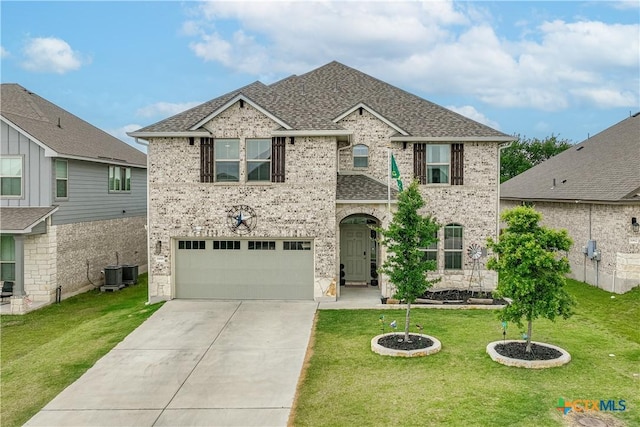 5998 Galveston Rd, Belton, TX 76513 - view of front facade featuring an attached garage, concrete driveway, and a front lawn