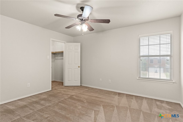 1505 Line Dance Ct, Killeen, TX 76542 - unfurnished bedroom with carpet flooring, baseboards, a spacious closet, and ceiling fan