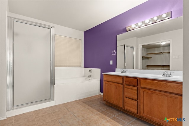 1505 Line Dance Ct, Killeen, TX 76542 - full bathroom with a shower stall, double vanity, a garden tub, tile patterned floors, and a spacious closet
