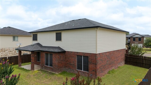 1505 Line Dance Ct, Killeen, TX 76542 - back of property with a patio area, brick siding, and a shingled roof