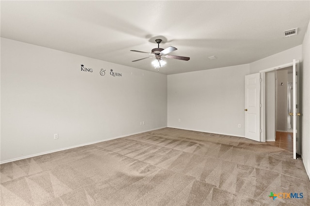 1505 Line Dance Ct, Killeen, TX 76542 - spare room featuring light carpet, ceiling fan, and baseboards