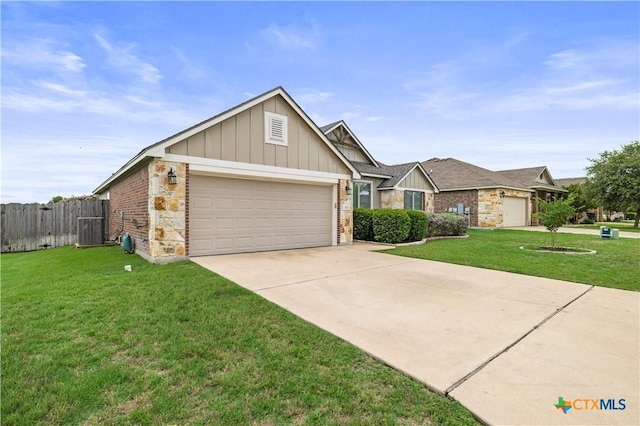 8113 Iron Gate Dr, Temple, TX 76502 - view of front of home featuring board and batten siding, an attached garage, driveway, and brick siding