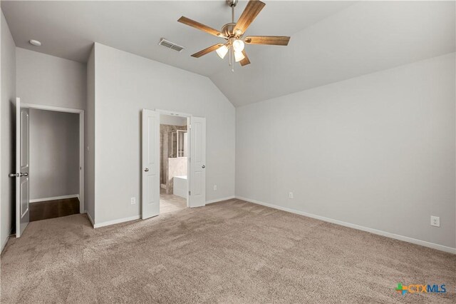 8113 Iron Gate Dr, Temple, TX 76502 - unfurnished bedroom with vaulted ceiling, light colored carpet, a ceiling fan, and ensuite bath