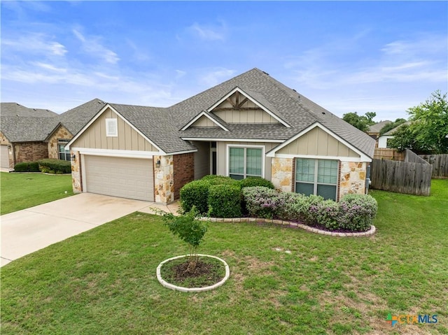 8113 Iron Gate Dr, Temple, TX 76502 - view of front of home with a shingled roof, an attached garage, board and batten siding, and stone siding