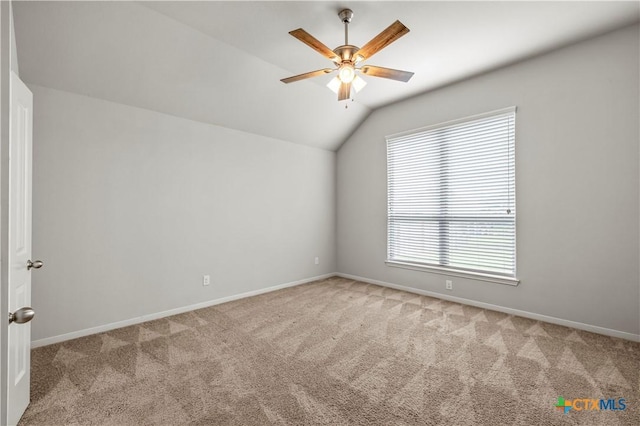 8113 Iron Gate Dr, Temple, TX 76502 - empty room featuring light carpet, vaulted ceiling, and a ceiling fan