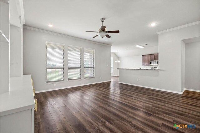 8113 Iron Gate Dr, Temple, TX 76502 - unfurnished living room featuring ceiling fan, ornamental molding, dark wood-style floors, and recessed lighting