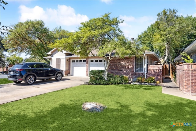 view of front of home with a garage and a front lawn