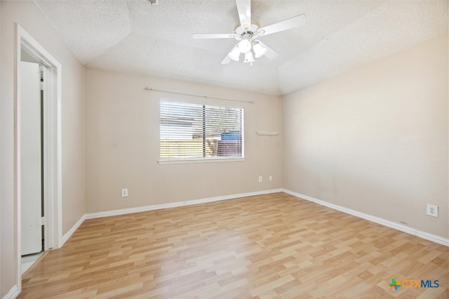 unfurnished bedroom with light hardwood / wood-style flooring, a textured ceiling, ceiling fan, and vaulted ceiling