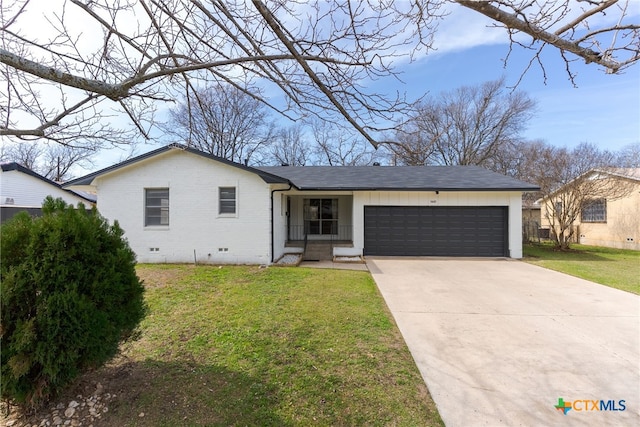 view of front of home featuring a front yard and a garage