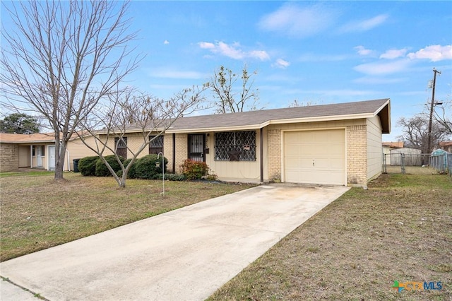 single story home featuring a front lawn and a garage