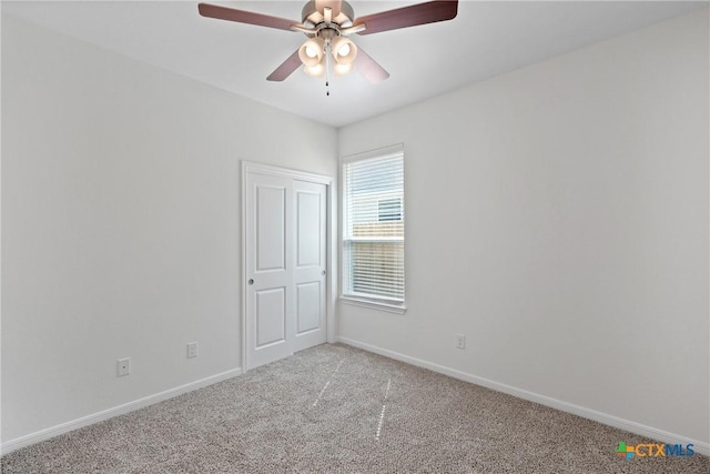 606 Killam Dr, Temple, TX 76502 - empty room featuring light carpet, ceiling fan, and baseboards