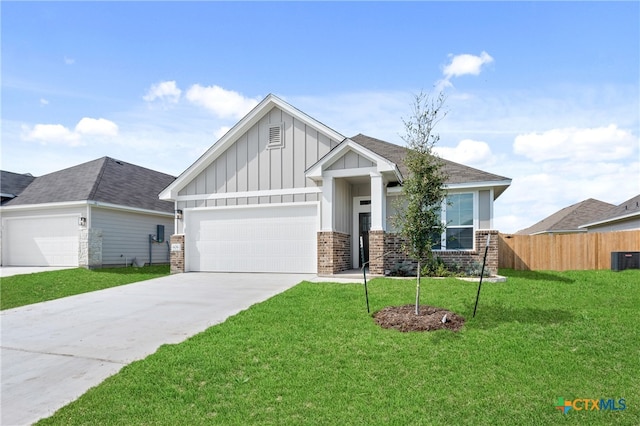 view of front of home with a garage and a front lawn