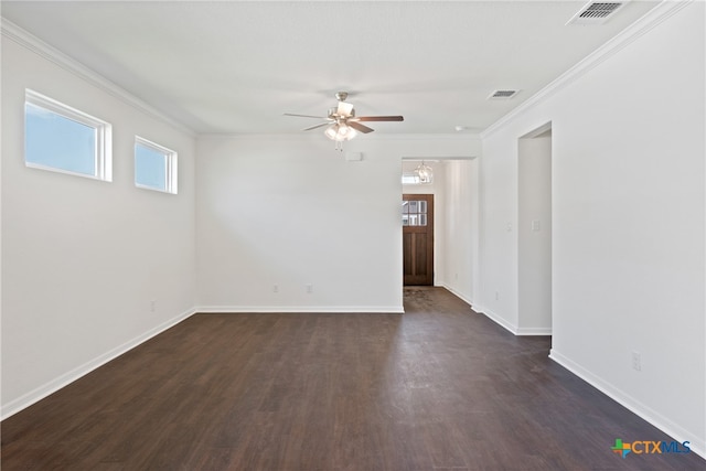 spare room with ceiling fan, dark hardwood / wood-style floors, and crown molding