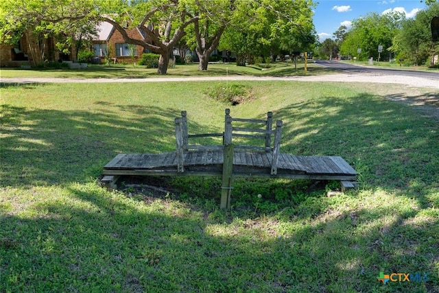 215 Taylor Rd, Elgin, TX 78621 - view of home's community with a lawn