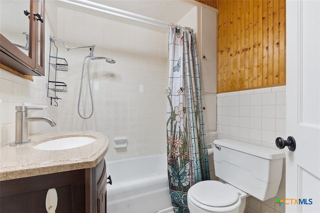 215 Taylor Rd, Elgin, TX 78621 - bathroom with decorative backsplash, tile walls, shower / tub combo, vanity, and toilet