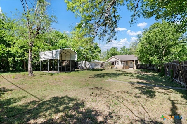 215 Taylor Rd, Elgin, TX 78621 - view of yard with fence and a carport