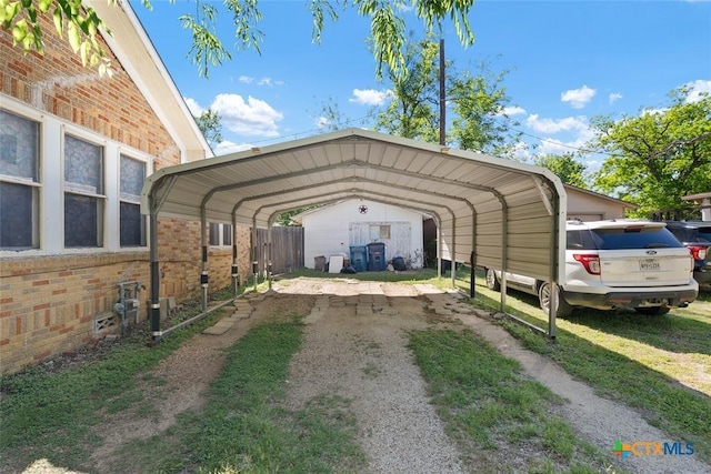 215 Taylor Rd, Elgin, TX 78621 - view of car parking featuring a detached carport and driveway