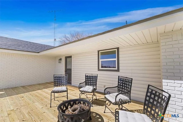 deck featuring a fire pit