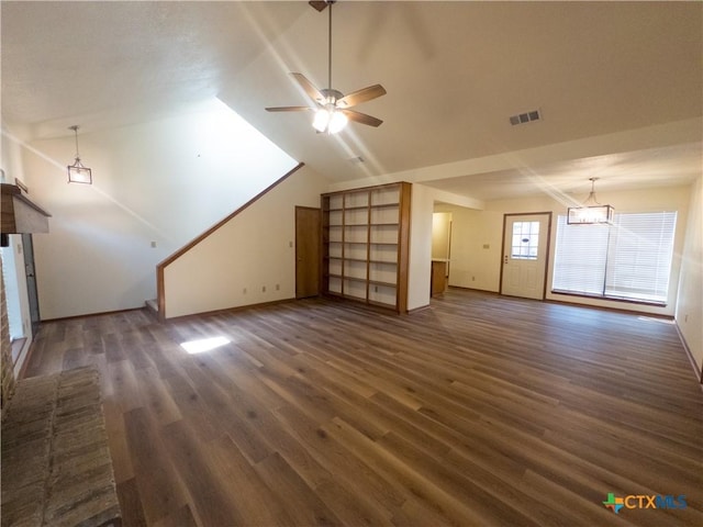 101 Maplewood Dr Unit 28, Victoria, TX 77901 - unfurnished living room with wood finished floors, ceiling fan, vaulted ceiling, baseboards, and a chandelier