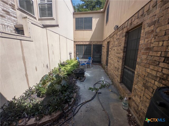 101 Maplewood Dr Unit 28, Victoria, TX 77901 - view of patio / terrace featuring a fire pit