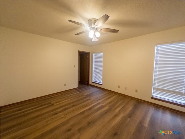 101 Maplewood Dr Unit 28, Victoria, TX 77901 - empty room featuring wood finished floors, ceiling fan, baseboards, and a textured ceiling