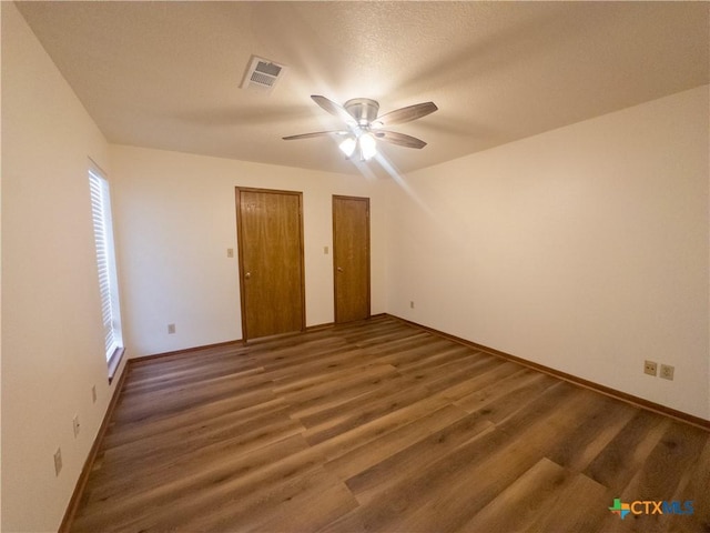 101 Maplewood Dr Unit 28, Victoria, TX 77901 - unfurnished room with ceiling fan, wood finished floors, and baseboards