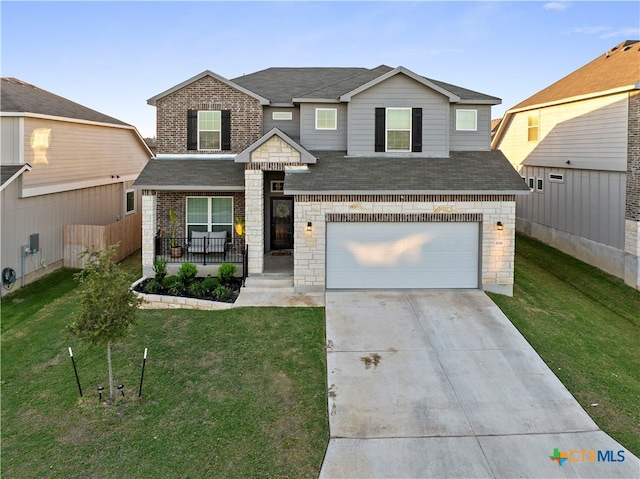 view of front of home with a garage and a front yard