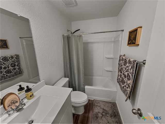 full bathroom featuring toilet, shower / bath combo, vanity, and wood-type flooring