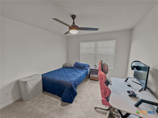 bedroom featuring light carpet and ceiling fan