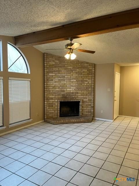 unfurnished living room with vaulted ceiling with beams, ceiling fan, light tile patterned floors, and a textured ceiling