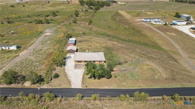 birds eye view of property featuring a rural view