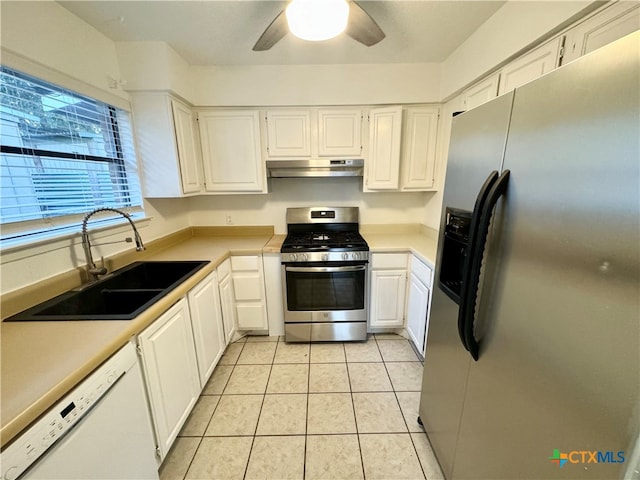 kitchen with ceiling fan, sink, light tile patterned floors, white cabinets, and appliances with stainless steel finishes