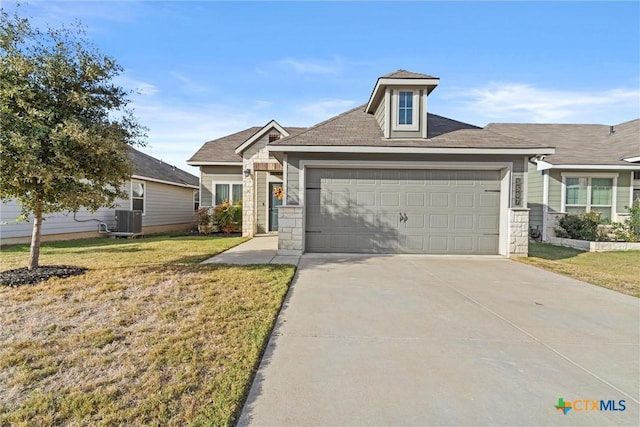 view of front facade with central AC, a front yard, and a garage