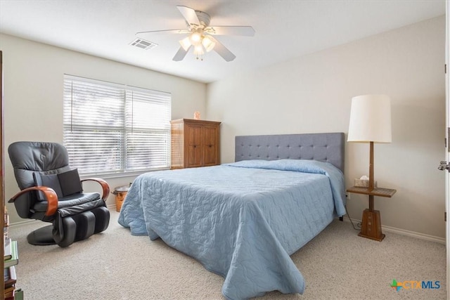 bedroom featuring ceiling fan and light carpet