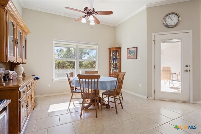 dining area featuring ceiling fan, light tile patterned floors, and ornamental molding