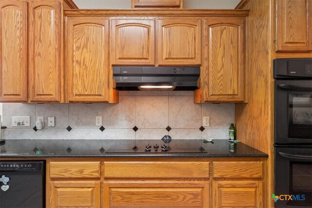 kitchen with black appliances, dark stone counters, and tasteful backsplash