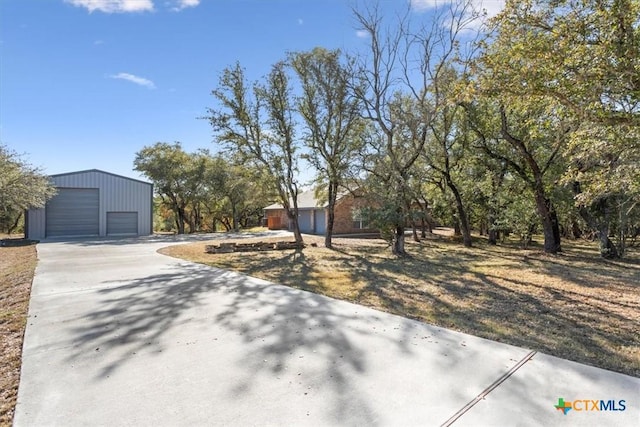 view of front facade with a garage and an outdoor structure