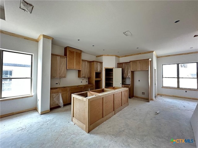 2026 Yarrow Rd, Temple, TX 76502 - kitchen with a kitchen island, baseboards, and ornamental molding