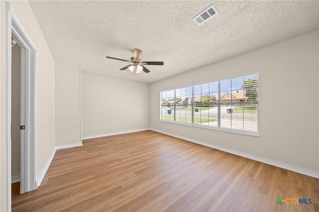 116 Spur Dr, Copperas Cove, TX 76522 - spare room with light wood-style floors, ceiling fan, and a textured ceiling
