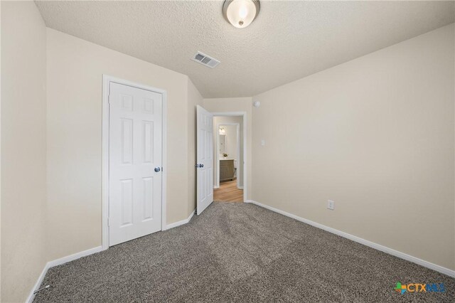 116 Spur Dr, Copperas Cove, TX 76522 - unfurnished bedroom with carpet and a textured ceiling