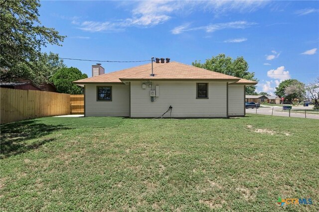 116 Spur Dr, Copperas Cove, TX 76522 - rear view of property featuring a fenced backyard and a chimney