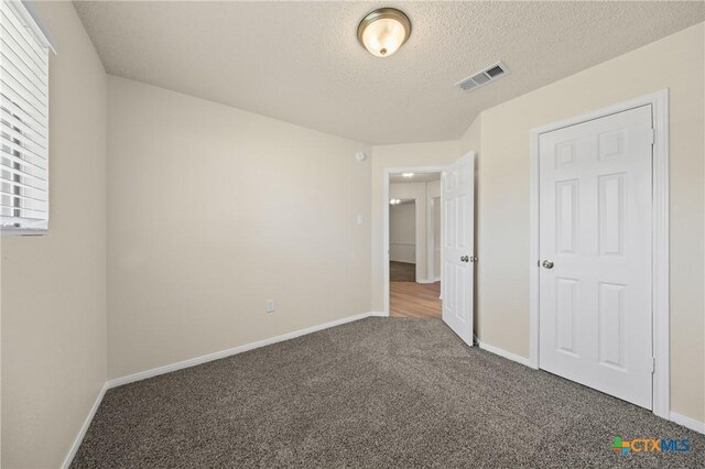 116 Spur Dr, Copperas Cove, TX 76522 - unfurnished bedroom with carpet and a textured ceiling