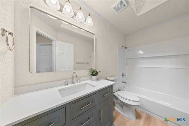 116 Spur Dr, Copperas Cove, TX 76522 - bathroom with a textured wall, vanity, wood finished floors, and bathtub / shower combination