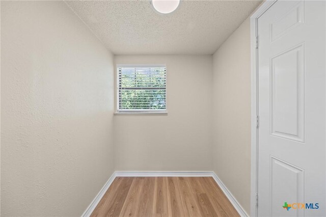 116 Spur Dr, Copperas Cove, TX 76522 - spare room featuring wood finished floors and a textured ceiling