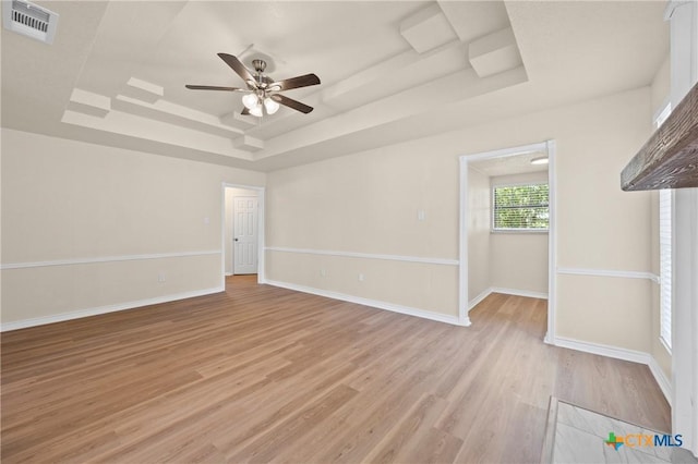116 Spur Dr, Copperas Cove, TX 76522 - unfurnished room featuring a tray ceiling, a ceiling fan, and light wood-style flooring