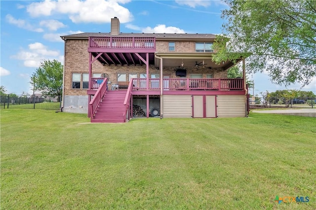 back of house with a deck, stairway, a chimney, brick siding, and a ceiling fan