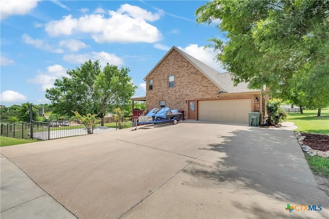 view of home's exterior featuring concrete driveway, a garage, fence, and brick siding