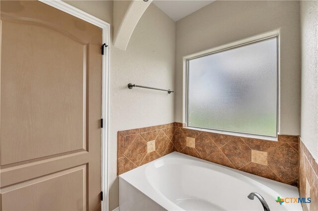 bathroom featuring a bath