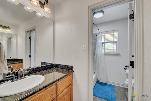 full bathroom with vanity, toilet, and shower / bath combo with shower curtain